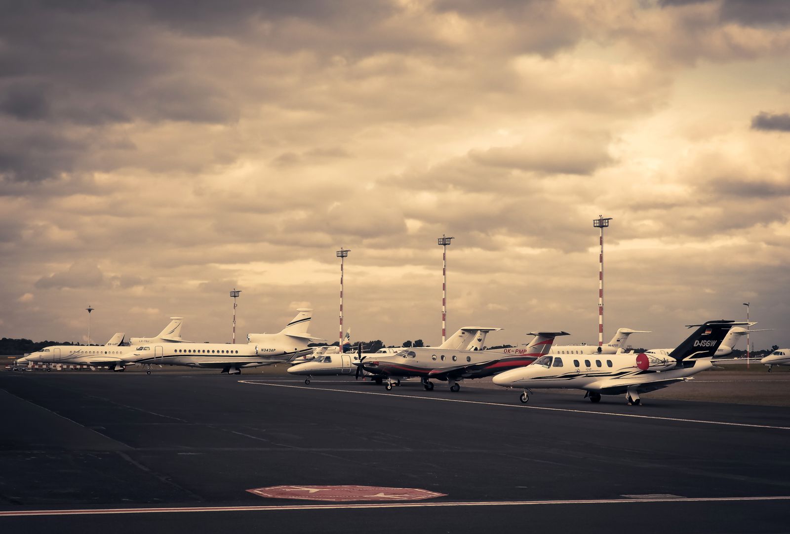 Light jets lined up on the apron