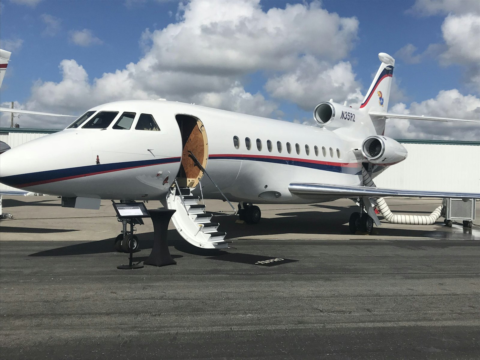 Dassault Falcon business jet with boarding stairs